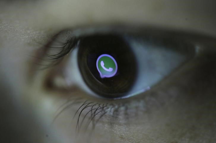 © Reuters. Picture illustration shows Whatsapp's logo reflected in a person's eye, in central Bosnian town of Zenica
