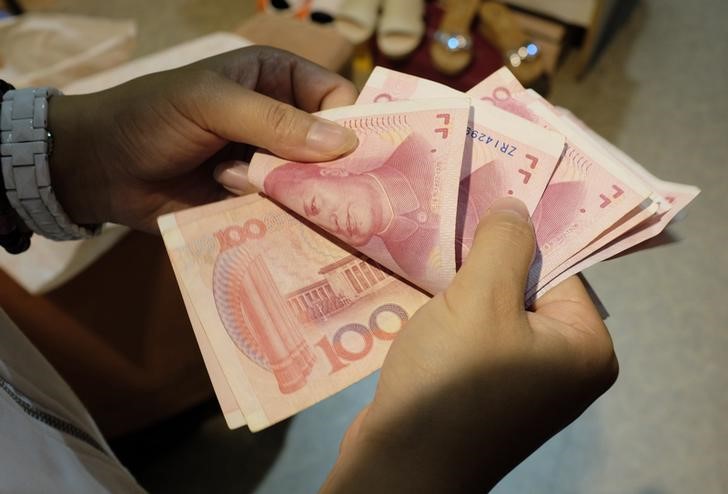 © Reuters. China dice que acelerará reformas para incluir al yuan entre monedas del FMI