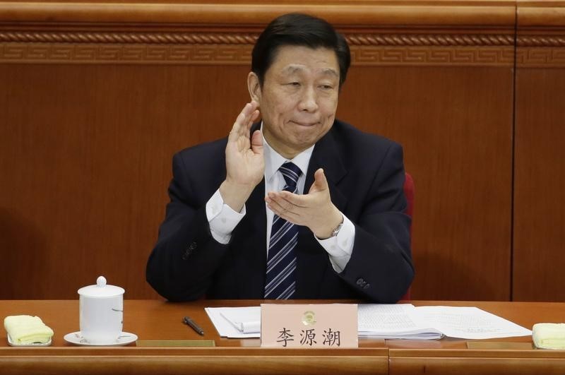 © Reuters. China's Vice President Li Yuanchao claps during the opening session of  CPPCC in Beijing