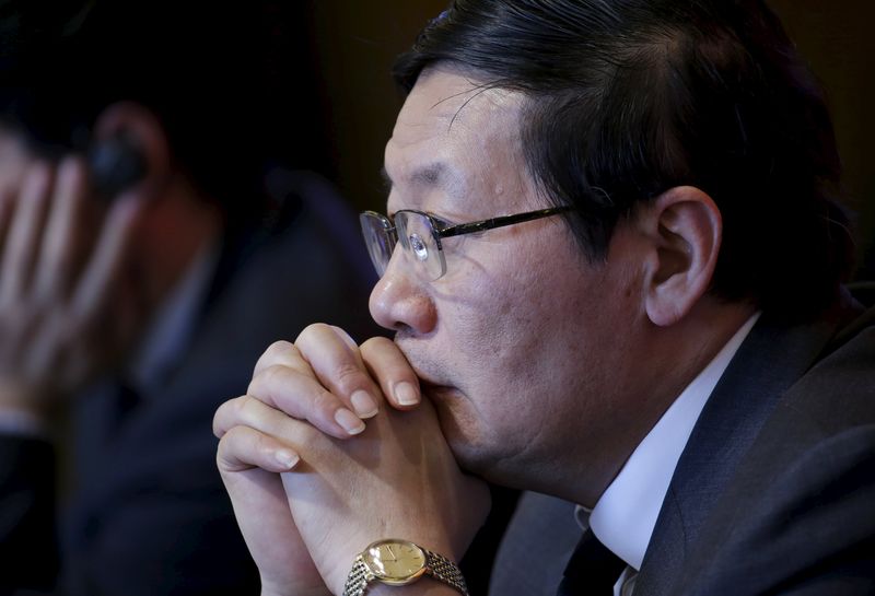 © Reuters. China's Finance Minister Lou Jiwei listens to a question at China Development Forum in Beijing