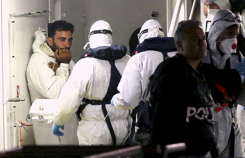 © Reuters. Mohammed Ali Malek, one of two survivors of Saturday's migrant boat disaster, arrested on suspicion of people trafficking, is seen as they arrive in Catania