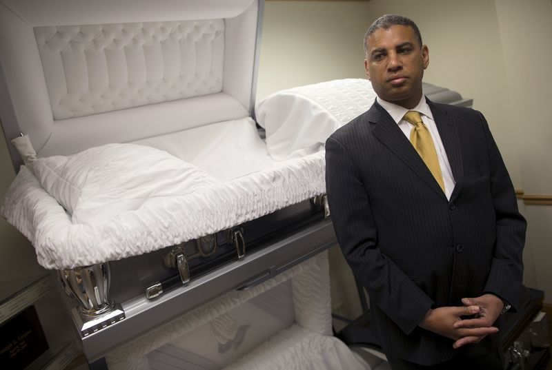 © Reuters. Spencer Leak, Jr., Vice President and licensed Funeral Director at Leak & Sons Funeral Homes, poses for a photograph in the display room in Country Club Hills