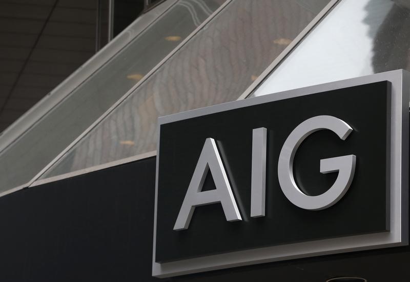 © Reuters. A new sign is displayed over the entrance to the AIG headquarters offices in New York's financial district