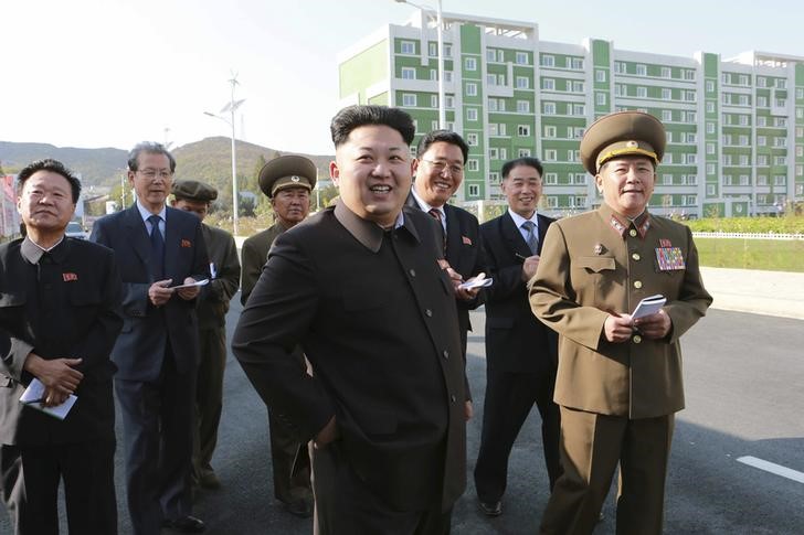 © Reuters. North Korean leader Kim Jong Un gives field guidance at the newly built Wisong Scientists Residential District  in this undated photo released by KCNA