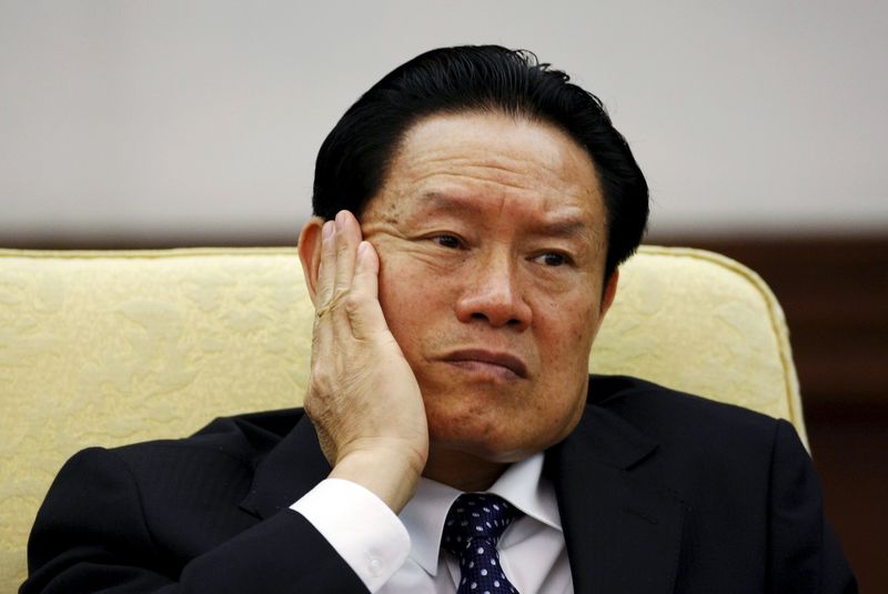 © Reuters. File photo of China's former Public Security Minister Zhou reacting as he attends the Hebei delegation discussion sessions at the 17th National Congress of the CPC in Beijing