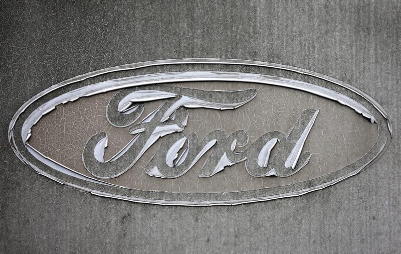 © Reuters. A faded Ford logo is pictured at the reception of the Ford assembly plant in Genk