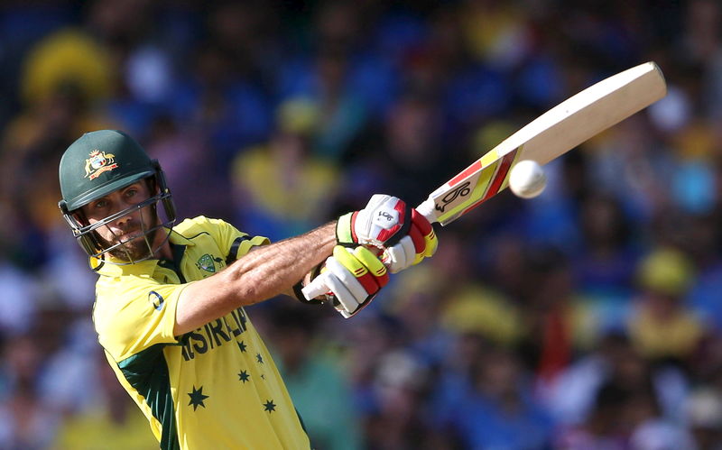 © Reuters. Australia's batsman Glenn Maxwell hits four runs off India's bowler Umesh Yadav during their  Cricket World Cup semi-final match in Sydney