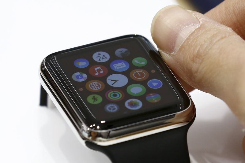 © Reuters. Woman uses Apple Watch on display at electronics store in Tokyo 