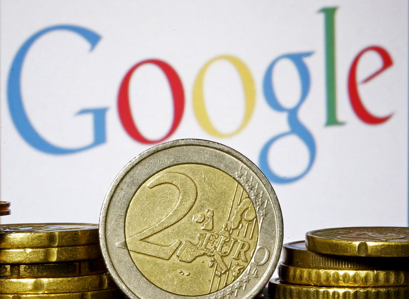 © Reuters. Euro coins are seen in front of a Google logo in this picture illustration taken in Zenica
