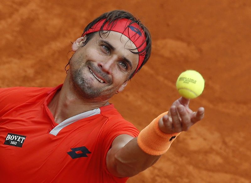 © Reuters. Ferrer serves during his match against Simon at the Monte Carlo Masters in Monaco