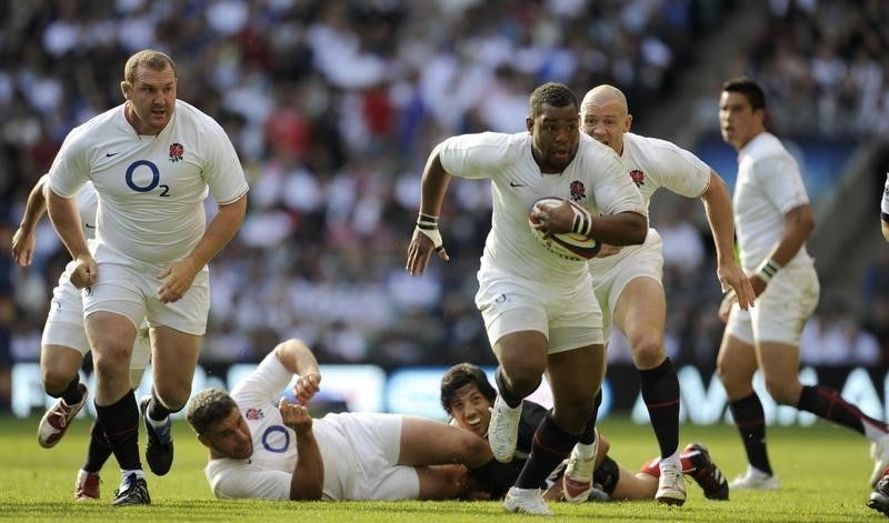 © Reuters. England's Steffon Armitage picks up a loose ball and charges towards the  Barbarians' line during their rugby union match at Twickenham Stadium in London