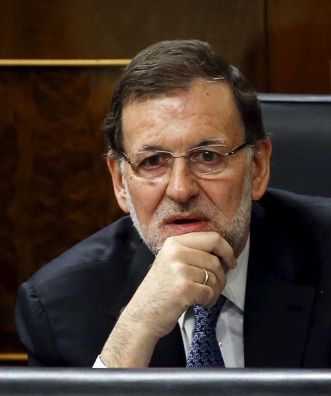 © Reuters. Spain's Prime Minister Mariano Rajoy listens to a question during a government control session at Spain's Parliament in Madrid