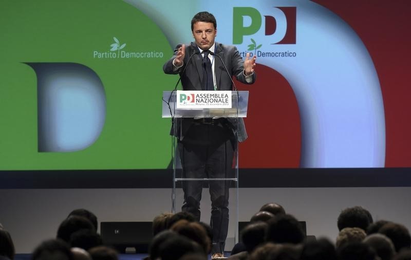 © Reuters. New elected centre-left Democratic Party (PD) leader Renzi gestures during his first national meeting in Milan