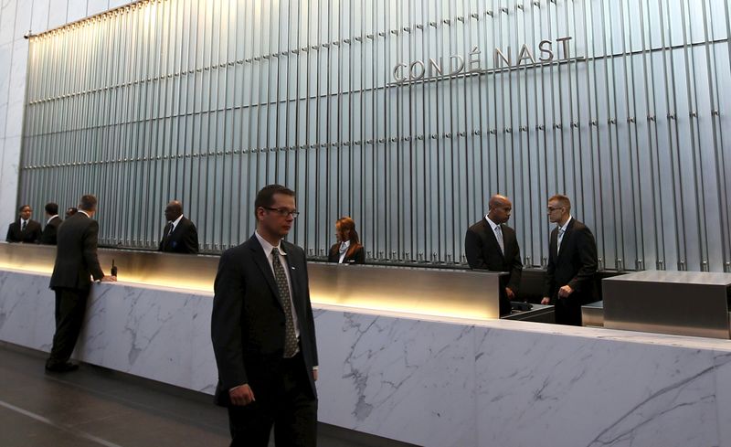 © Reuters. File photo of Conde Nast employees working in the lobby of the One World Trade Center tower in New York, United States