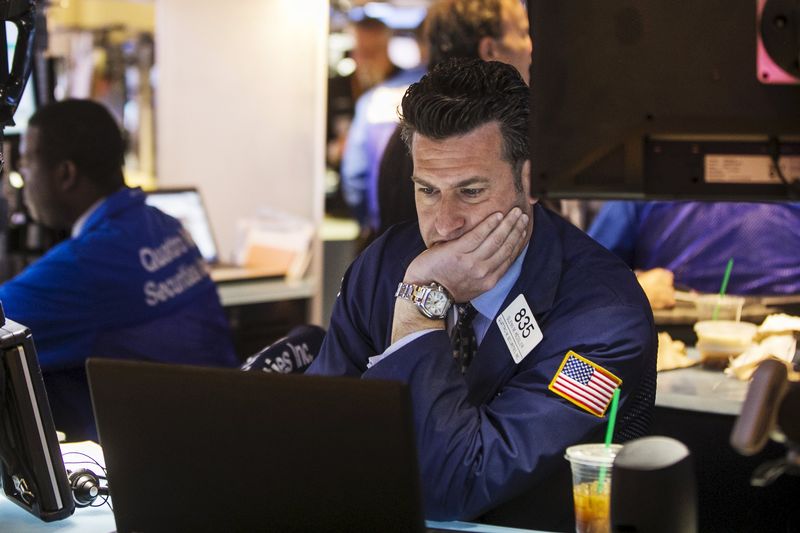 © Reuters. A trader works on the floor of the New York Stock Exchange shortly after the opening bell 