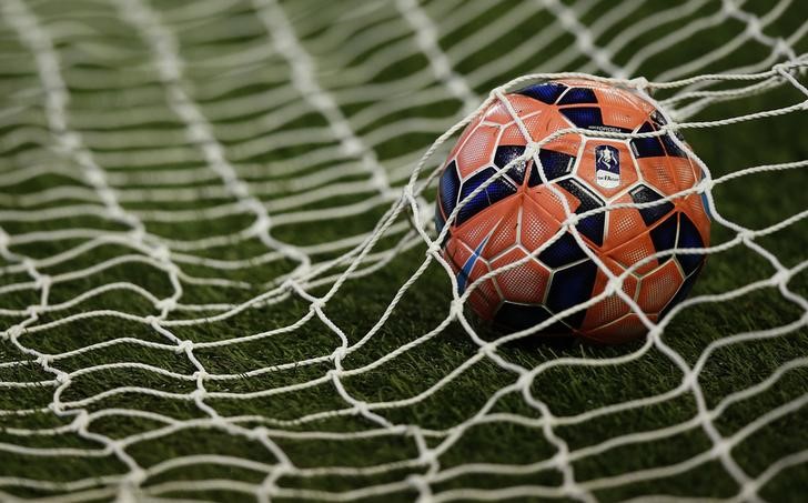 © Reuters. An FA Cup ball sits in the back of a goal before the FA Cup fourth round soccer match between Liverpool and Bolton Wanderers at Anfield in Liverpool