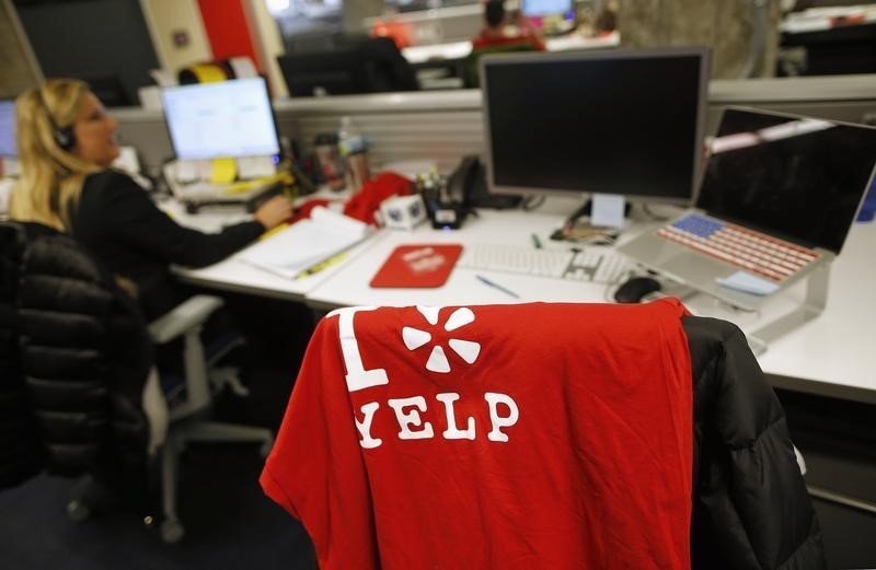 © Reuters. An employee works in the Yelp Inc. offices in Chicago