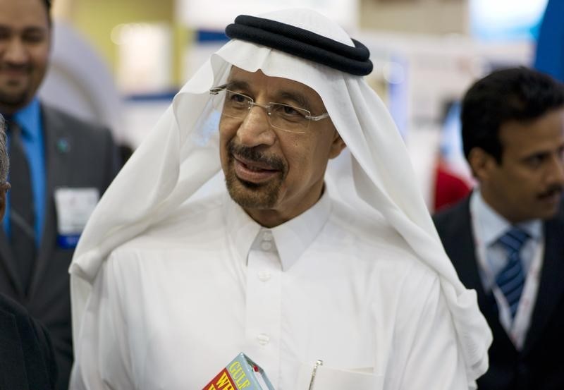 © Reuters. Saudi Aramco Chief Executive Officer Khalid al-Falih speaks to the media at the company's booth during Petrotech 2014 in Manama
