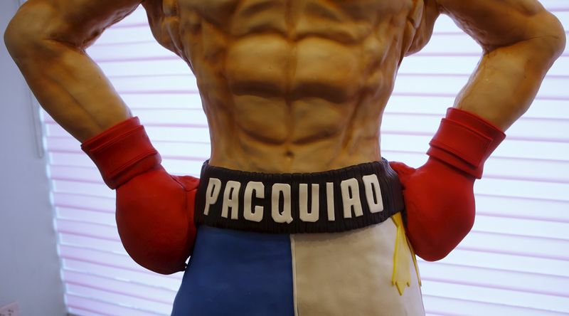 © Reuters. The name of local boxing icon Manny Pacquiao is pictured on a life-size 70-kg chocolate cake which is displayed to the media at a restaurant in Manila