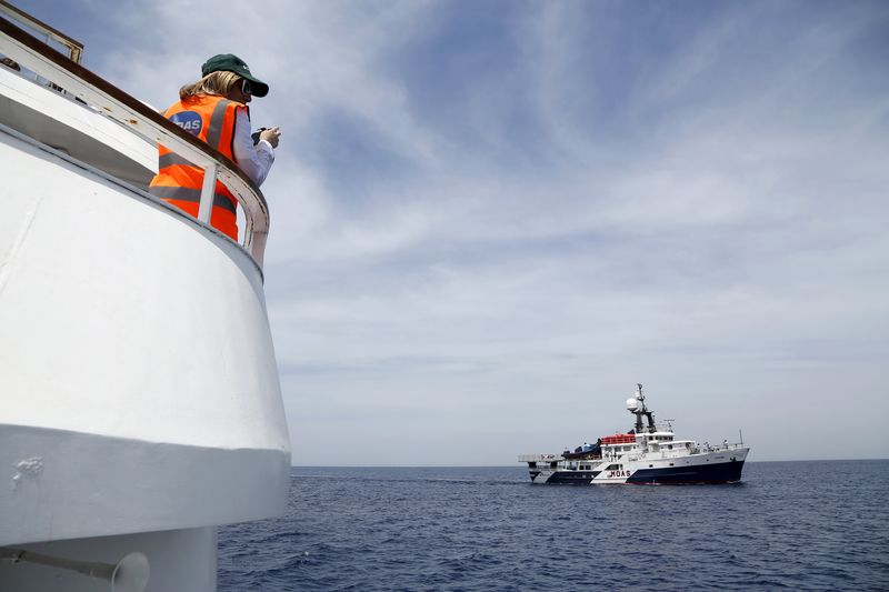 © Reuters. Migrant Offshore Aid Station founder Regina Catrambone of Italy watches as the MOAS ship MV Phoenix sails outside Valletta's Grand Harbour