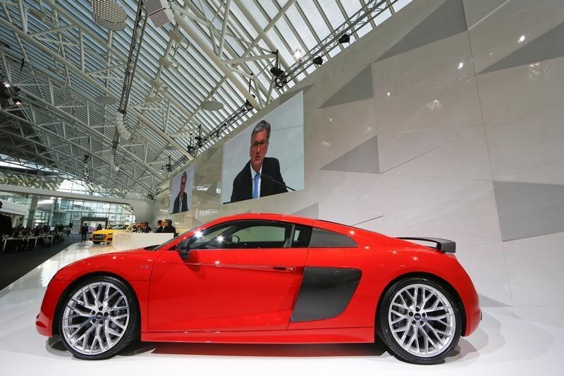 © Reuters. Audi Chief Executive Officer Stadler is seen on video screens behind an Audi R8 sports car at the annual news conference in the Bavarian city of Ingolstadt