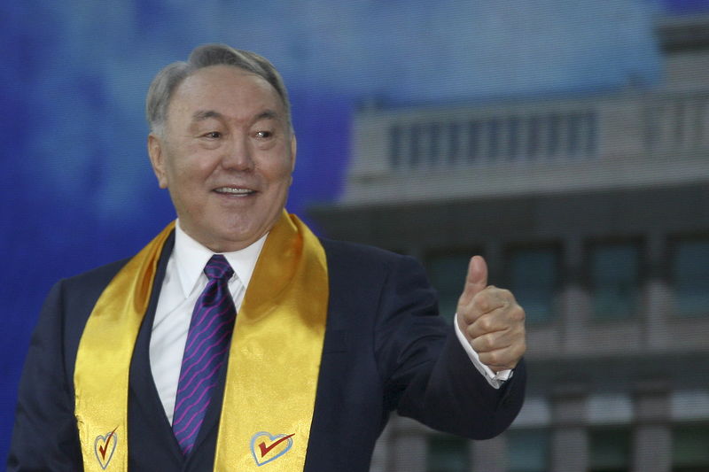 © Reuters. Kazakhstan's President Nazarbayev who was re-elected gestures during post-election rally in Astana