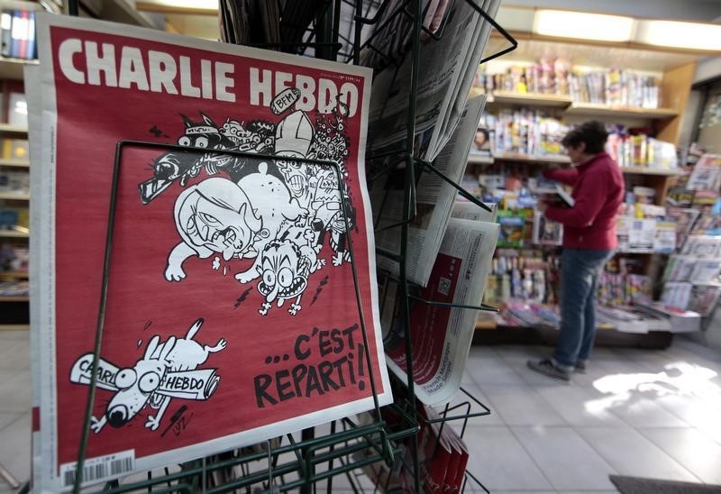 © Reuters. The front page of the new issue of satirical French weekly Charlie Hebdo entitled is displayed at a kiosk in Nice