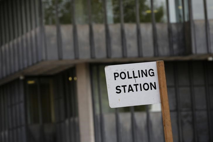 © Reuters. A polling station sign is seen in central London