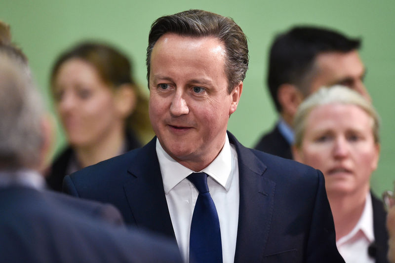 © Reuters. Britain's Prime Minister David Cameron greets supporters as he arrives at the counting centre for his local constituency as ballots are tallied in Britain's general election in Witney