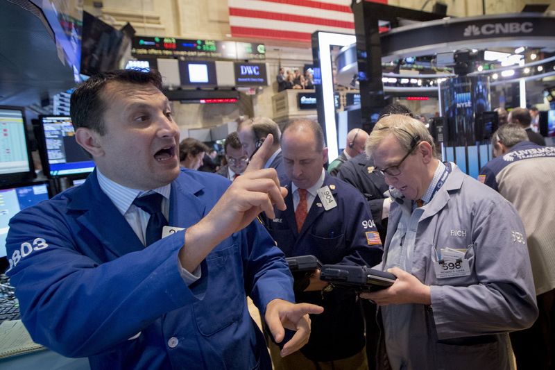 © Reuters. Specialist trader Surace gives price for Salesforce.com Inc. prior to the opening bell on the floor of the New York Stock Exchange