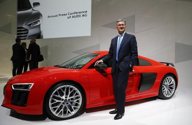 © Reuters. Audi Chief Executive Officer Stadler poses with an Audi R8 sports car at the annual news conference in the Bavarian city of Ingolstadt