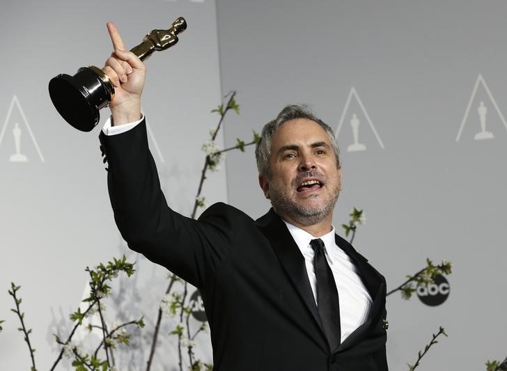 © Reuters. Cineasta Alfonso Cuarón comemora conquista do Oscar por "Gravidade" 