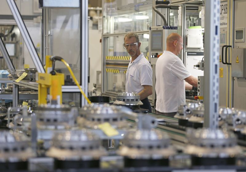 © Reuters. Employees of Punch Powerglide work at the automatic transmissions production line at their factory in Strasbourg