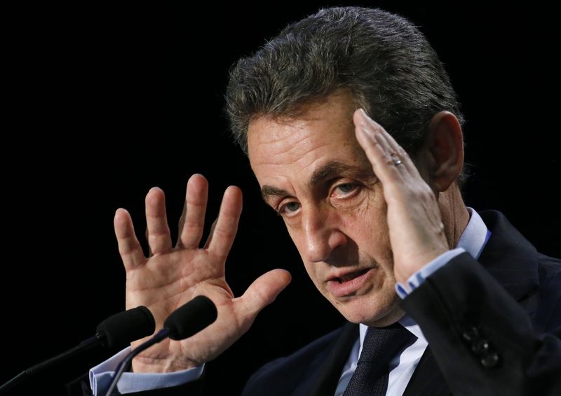 © Reuters. File picture shows former French president and current UMP conservative political party head Sarkozy as he attends a political rally in the Essonne department as he campaigns for French departmental elections in Palaiseau