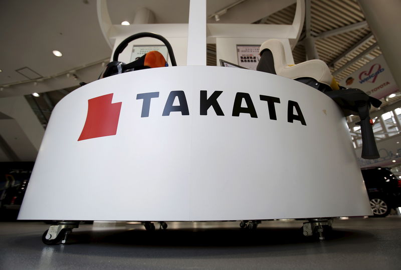 © Reuters. A logo of Takata Corp is seen with its display at a showroom for vehicles in Tokyo