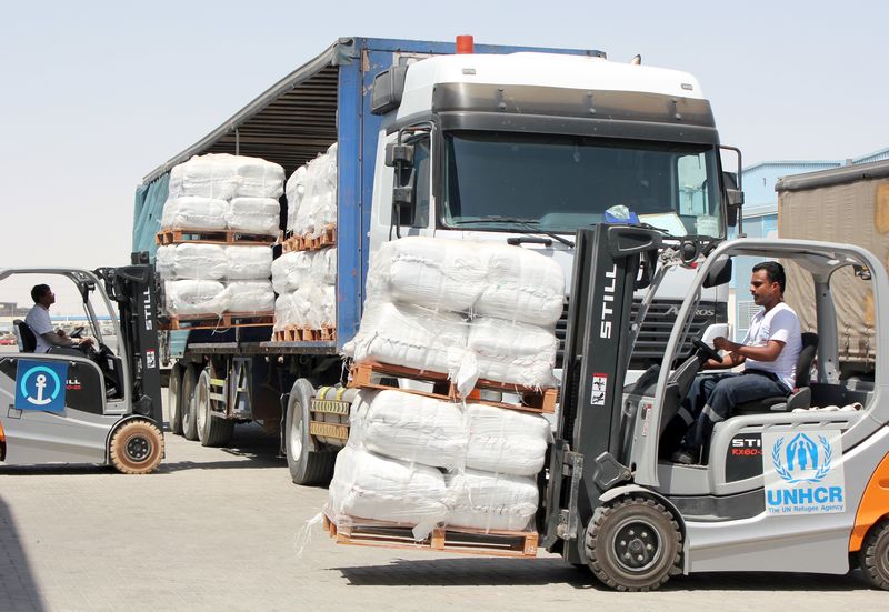 © Reuters. A UNHCR employee arranges aid for Yemen at Dubai International Humanitarian city in Dubai