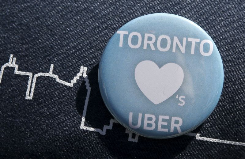 © Reuters. An Uber supporter's pin is seen during a rally in front of city hall in Toronto