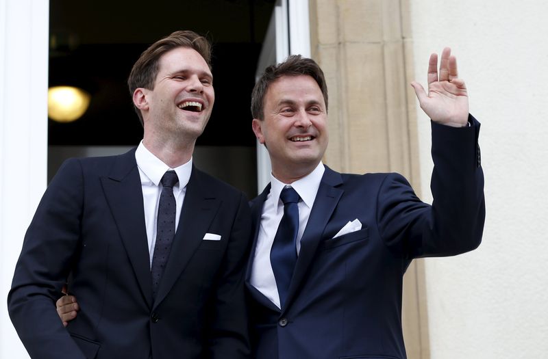 © Reuters. Luxembourg's PM Bettel poses with his partner Destenay after their wedding ceremony at Luxembourg's city hall