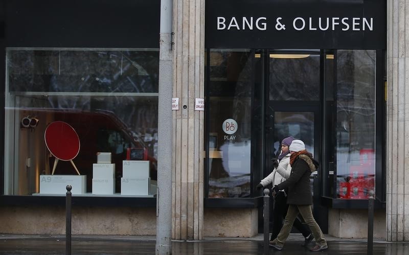 © Reuters. People stroll past a Bang & Olufsen shop in centre of Budapest