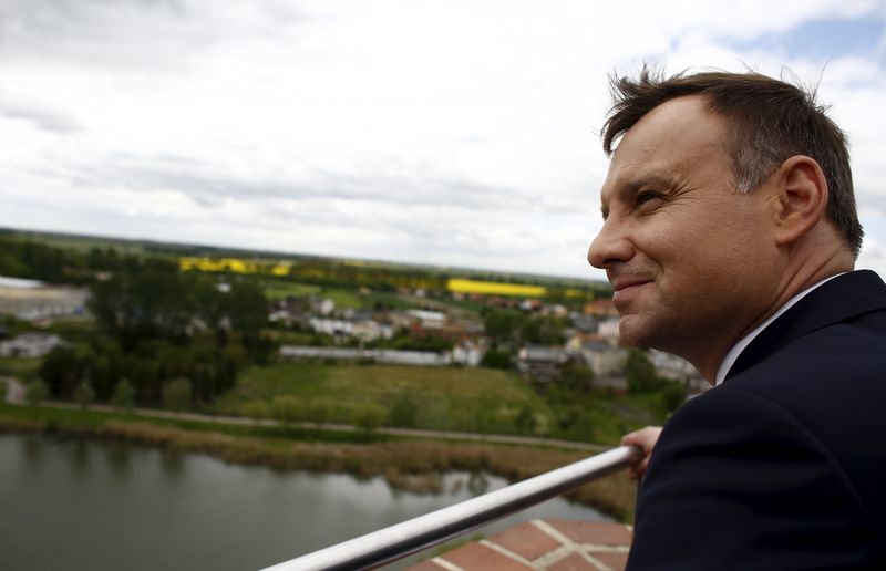 © Reuters. Andrzej Duda, presidential candidate of the conservative opposition Law and Justice (PiS) party looks on as he attends his election meeting in Kruszwica near Inowroclaw