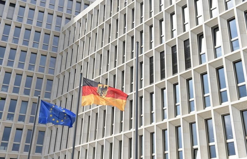 © Reuters. German and EU flags flutter outside the new Interior Ministry building in Berlin 