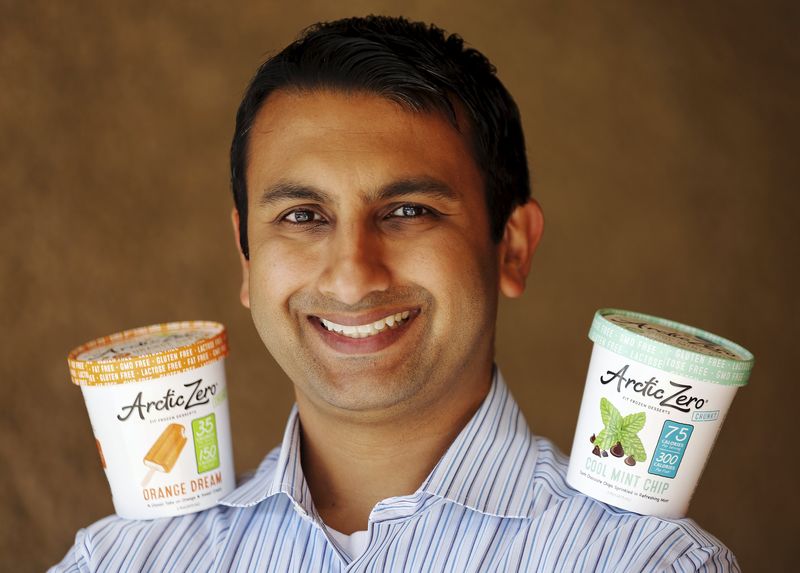 © Reuters. Arctic Zero CEO Pandhi poses for a picture with his company's healthy frozen dessert in San Diego