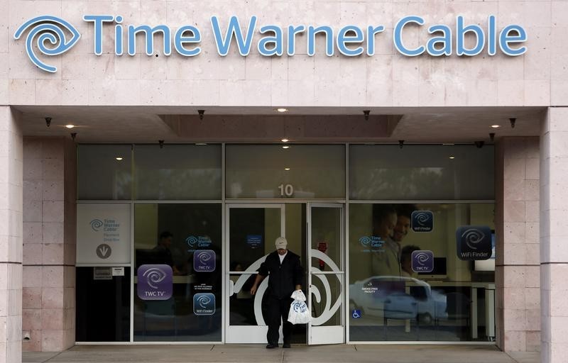 © Reuters. A customer leaves a Time Warner Cable store in Palm Springs