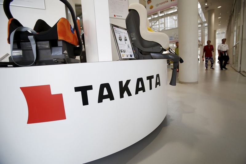 © Reuters. A logo of Takata Corp is seen with its display at a showroom for vehicles in Tokyo
