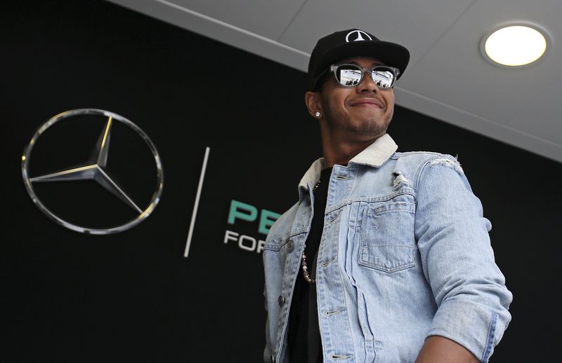 © Reuters. Mercedes Formula One driver Hamilton of Britain arrives in the paddock ahead the start of the third free practice session at the Monaco F1 Grand Prix
