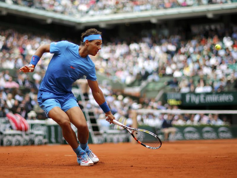 © Reuters. Rafael Nadal of Spain plays a shot to Quentin Halys of France during their men's singles match at the French Open tennis tournament at the Roland Garros stadium in Paris