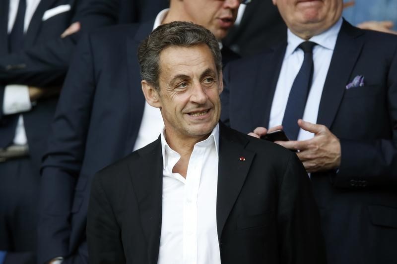 © Reuters. France's former president Nicolas Sarkozy attends the French Ligue 1 soccer match between Paris St Germain and Reims at the Parc des Princes stadium in Paris