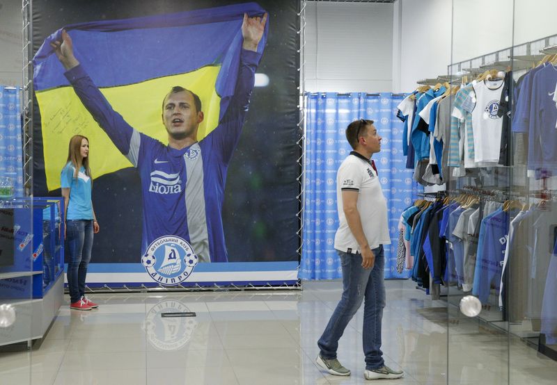 © Reuters. A man visits the Dnipro team's shop in Dnipropetrovsk