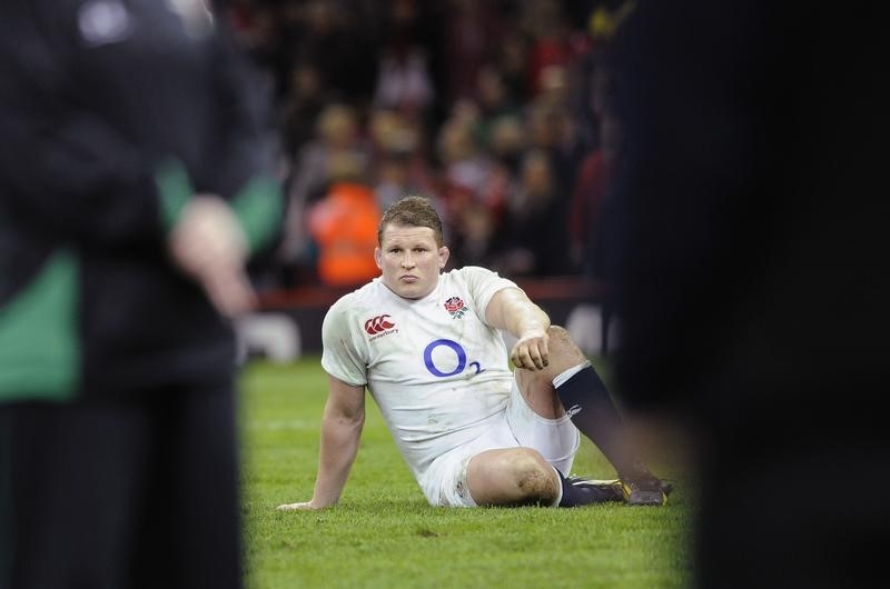 © Reuters. England's Dylan Hartley sits on the field after being defeated by Wales during their Six Nations international rugby union match at the Millennium Stadium in Cardiff