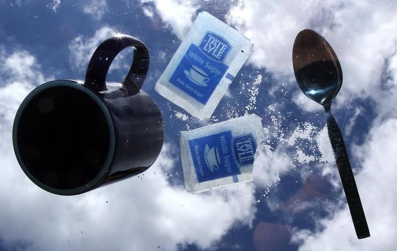 © Reuters. Sachets of Tate and Lyle sugar are seen on a glass table outside a coffee shop
